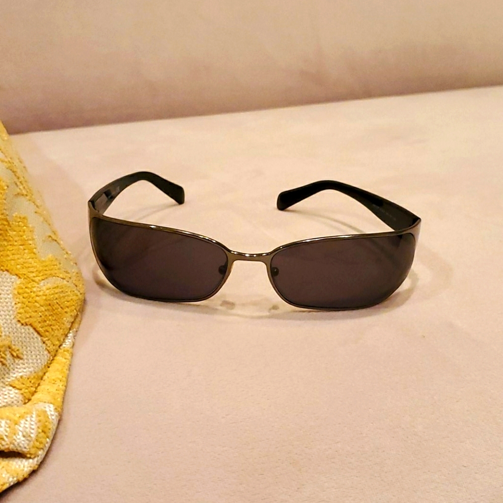Prada black & silver sunglasses with gray lens.